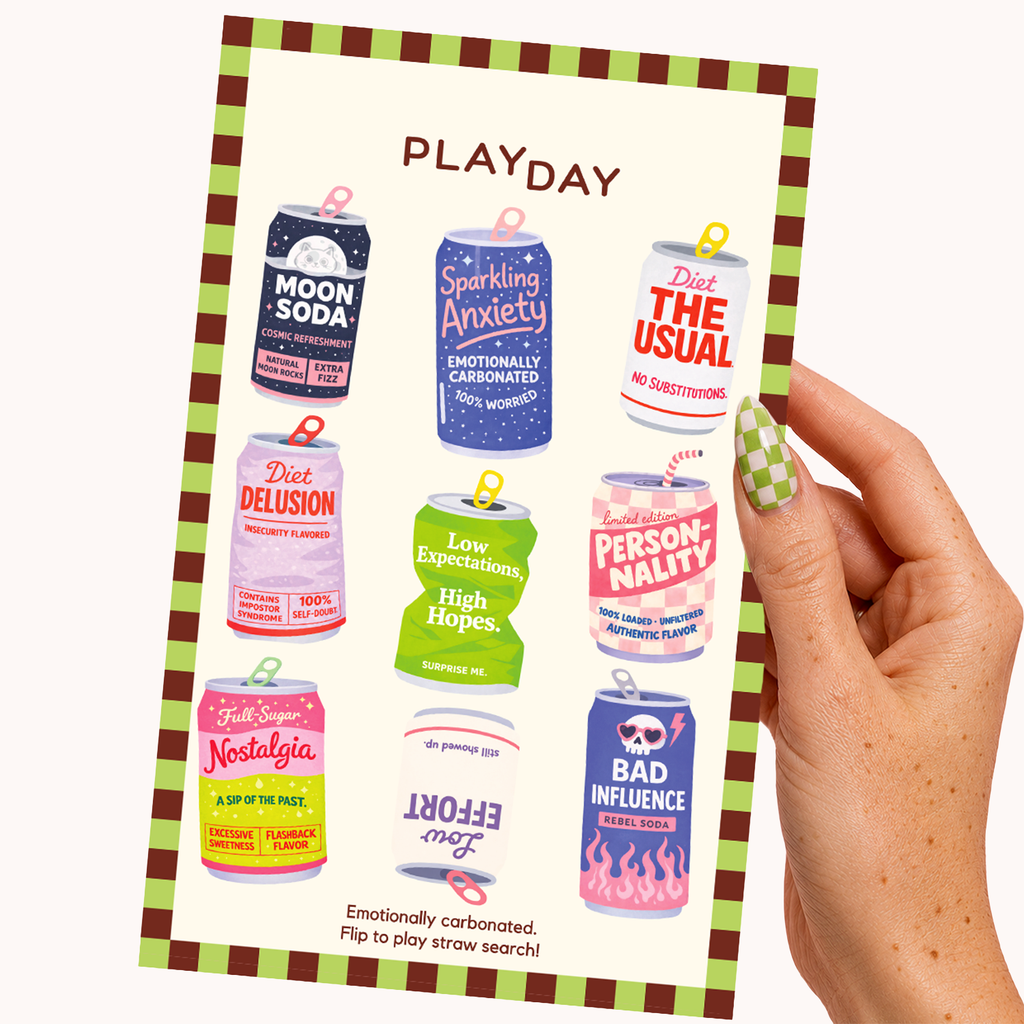 A hand holds a playday sticker sheet featuring colorful illustrated cans stickers labeled various phrases like Moon Soda, Sparking Anxiety, Diet Delusion, and Low Expectations, High Hopes. The card has a green and brown checkered border and is photographed against a plain off-white background.