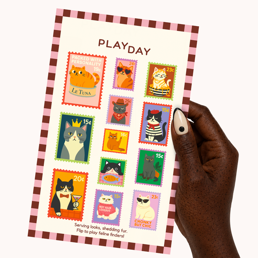 A hand holds a sticker sheetfeaturing colorful cat postage stamp illustrations and the word PLAYDAY at the top. The card has a pink-and-brown border and multiple illustrated cat stamps with different colors and expressions.