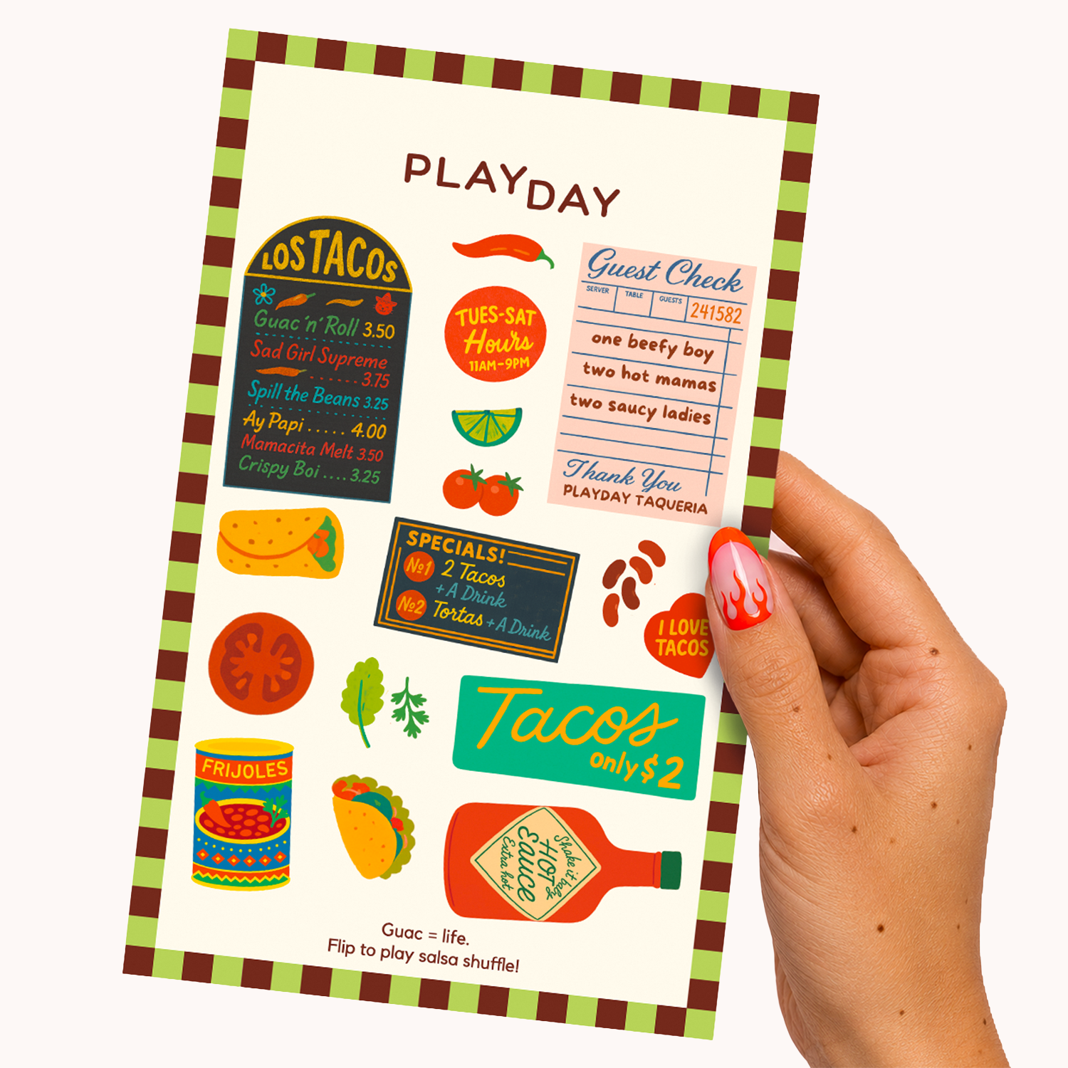 A hand with red nail polish holds a printed sticker sheet featuring taco-themed illustrations and text, including 'PLAYDAY' at the top, 'Los Tacos,' menu-style signs, a guest check, and taco graphics on a white background.