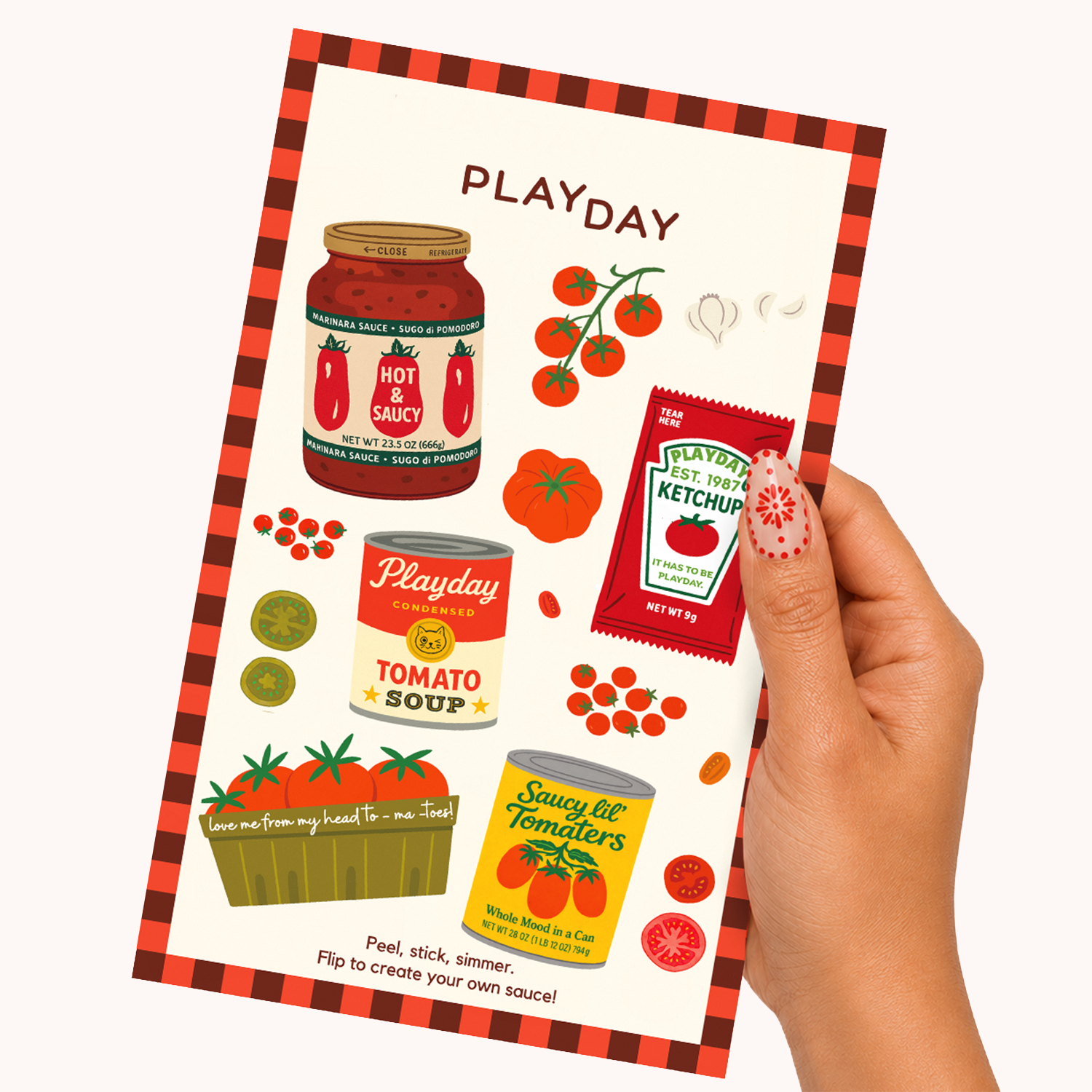 A hand holds a Playday sticker sheet featuring illustrated tomato-themed stickers, including a jar of sauce, tomato soup, ketchup, and canned tomatoes, on a plain light background.